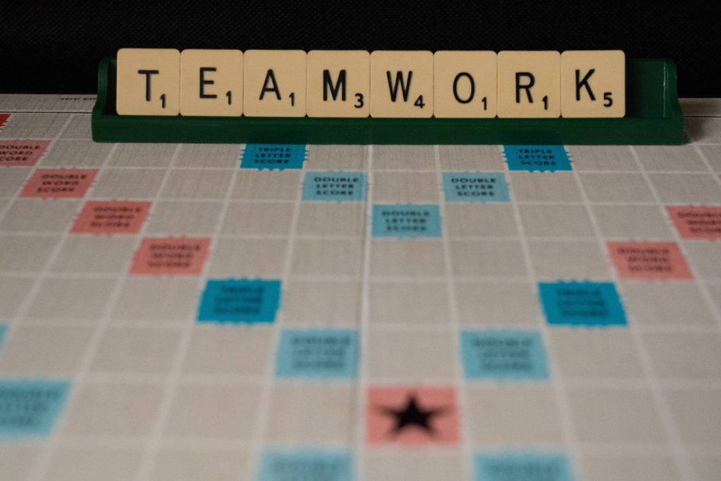 Teamwork made with Scrabble pieces